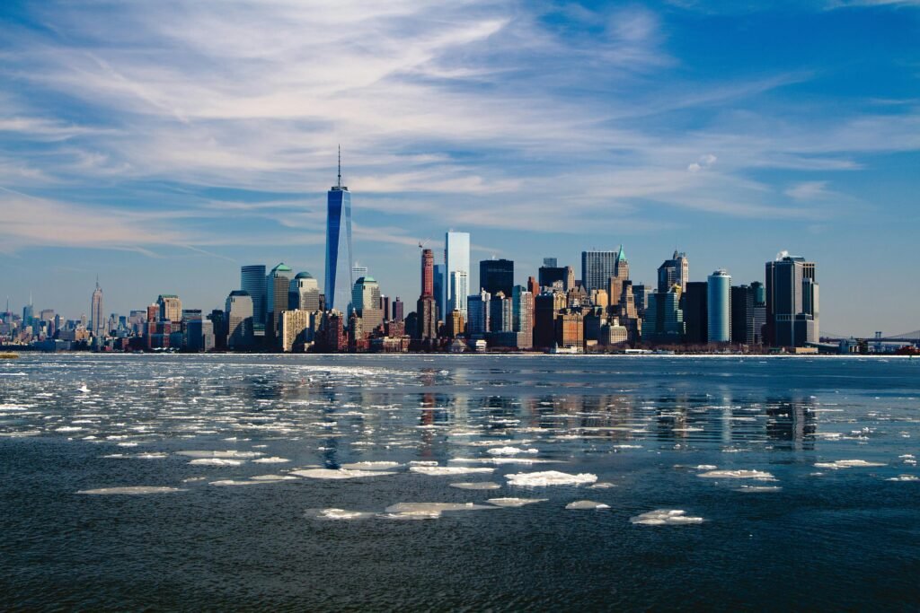 new-york-skyline-new-york-city-city-37646-37646 A stunning winter morning captures New York City skyline with icy waters in the foreground.